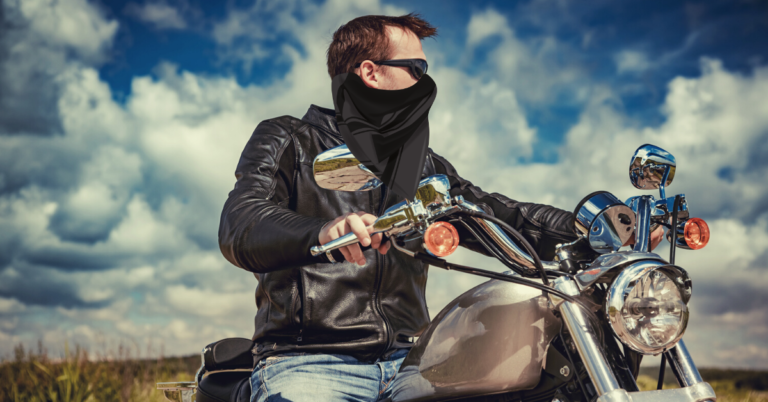 Man with a mask on a motorbike