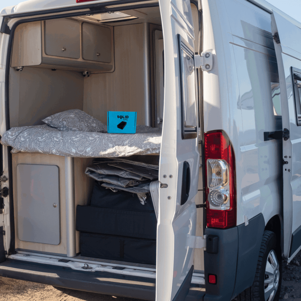 Solid GPS tracker mounted inside the back of a vehicle